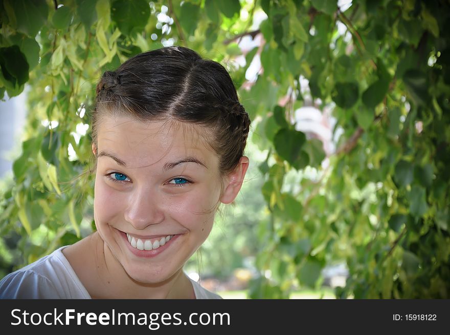 Young beautiful girl smile in the park. Young beautiful girl smile in the park