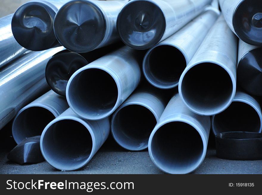 A stack of long cylinder pipes. A stack of long cylinder pipes.