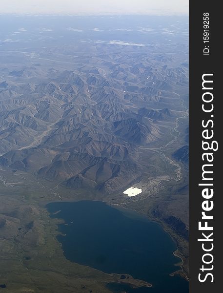 Tundra lake and moutains, view from airplane