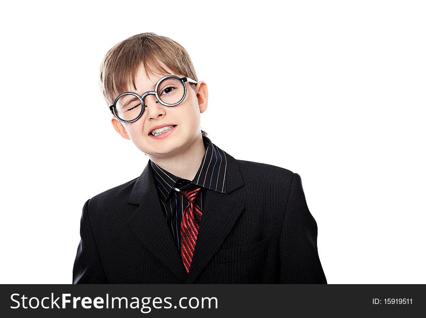 Educational theme: boy teenager posing in a suit and spectacles. Isolated over white background. Educational theme: boy teenager posing in a suit and spectacles. Isolated over white background.