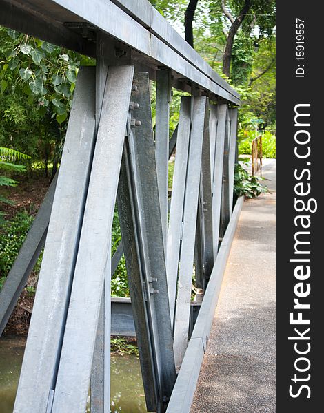 Bridge iron over water in the park, bridge in the park. Bridge iron over water in the park, bridge in the park