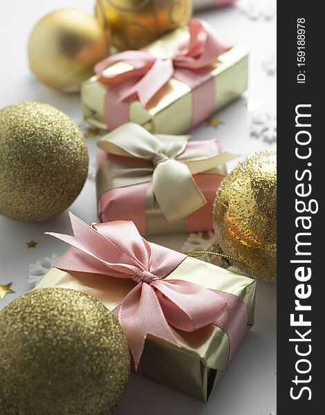 Beautiful golden gifts baubles on white. Christmas, party, birthday background. Celebrate shinny surprise boxes copy space. Creative flat lay top view, pink, ribbon, bow, sparkling, wedding, love, shopping, snowflakes, conffeti, globes, bubble, winter, isolated, present, celebration, decoration, holiday, valentine, wrap, give, package, anniversary, many, occasion, event, luxury, greeting, new, year, packaging, parcel, card, decorative, happy, packet. Beautiful golden gifts baubles on white. Christmas, party, birthday background. Celebrate shinny surprise boxes copy space. Creative flat lay top view, pink, ribbon, bow, sparkling, wedding, love, shopping, snowflakes, conffeti, globes, bubble, winter, isolated, present, celebration, decoration, holiday, valentine, wrap, give, package, anniversary, many, occasion, event, luxury, greeting, new, year, packaging, parcel, card, decorative, happy, packet