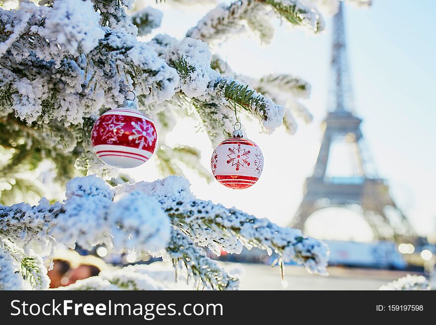 Christmas Tree Covered With Snow Near Eiffel Tower