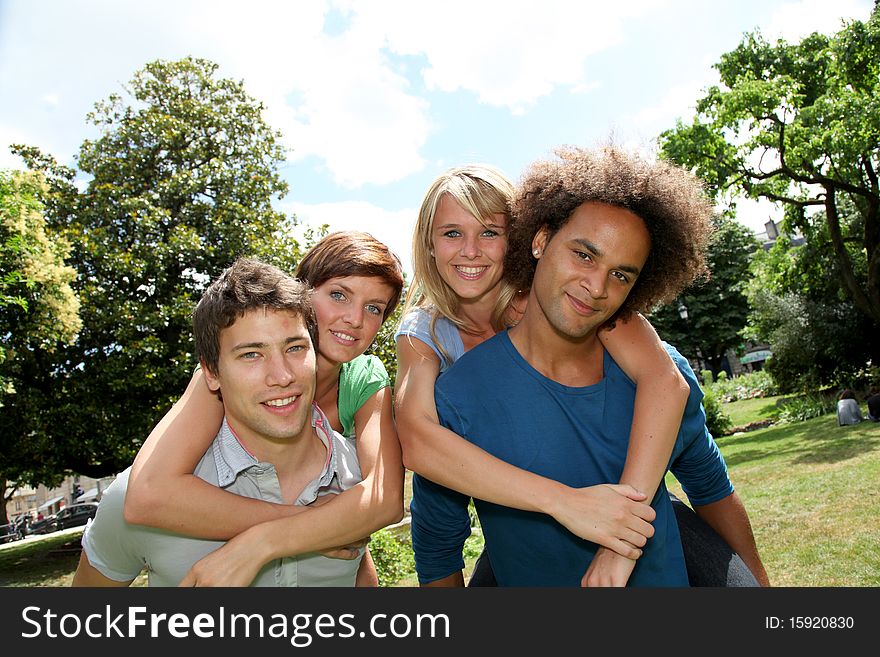 Friends doing piggyback in park. Friends doing piggyback in park