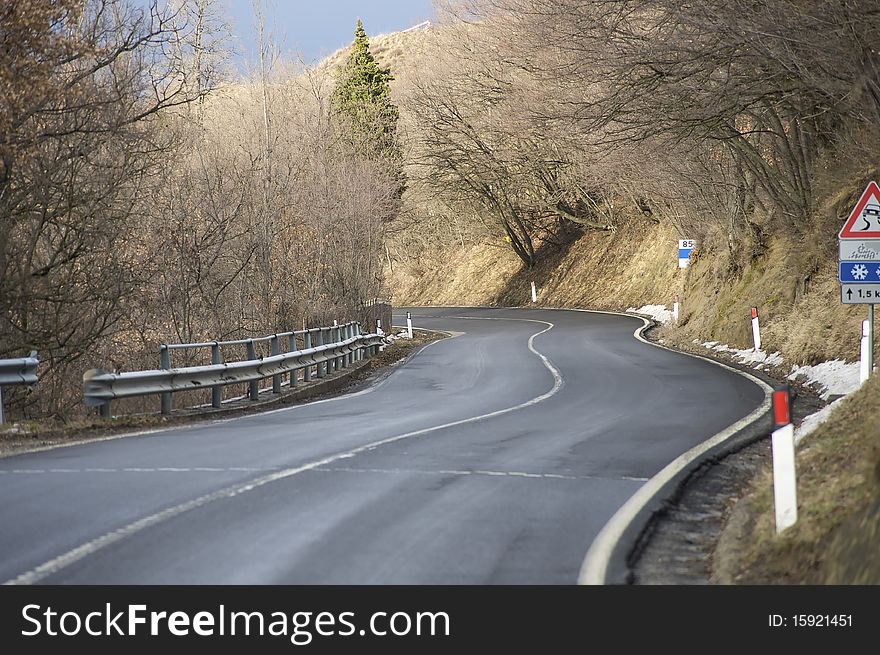 A mountain road turning on the left