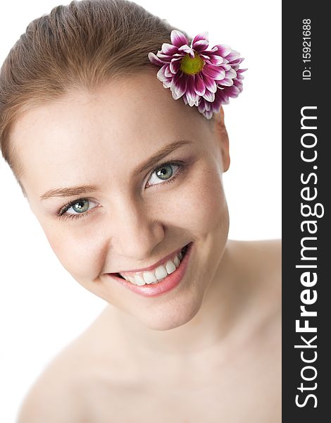 Beauty woman close-up face with flower over white background