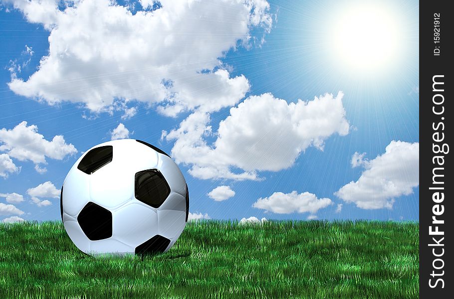 Soccer ball on green grass under blue sky