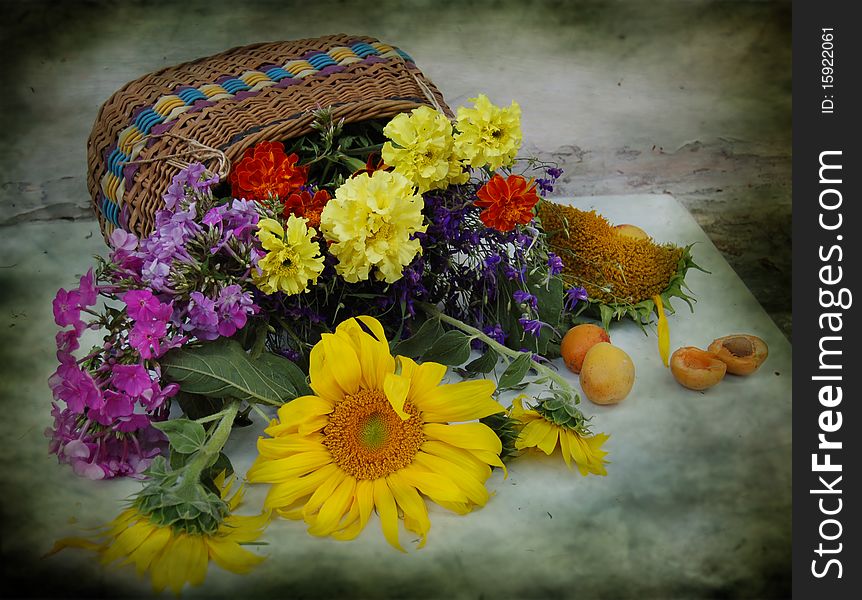 Basket with different, summer flowers. Basket with different, summer flowers