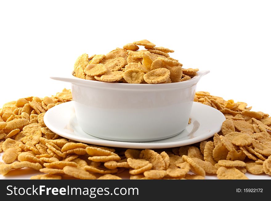 Flakes in the bowl on a white background