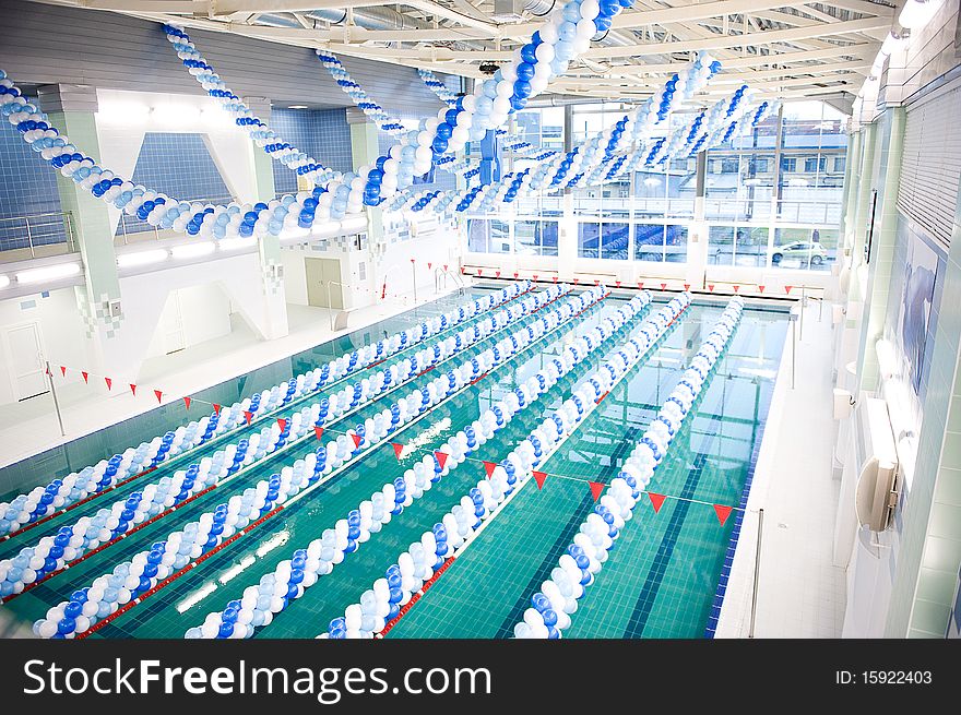 Swimmingpool decorated with blue and white balloons. Swimmingpool decorated with blue and white balloons