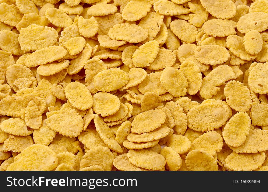 Background of yellow, brown cornflakes. Background of yellow, brown cornflakes