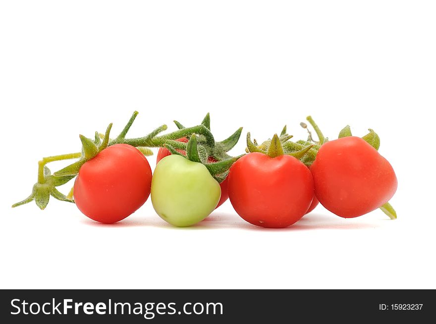 Green and red cherry tomatoes isolated on white