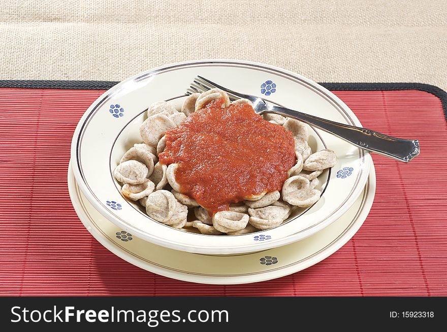 South italian traditional recipe orecchiette pasta with tomato sauce