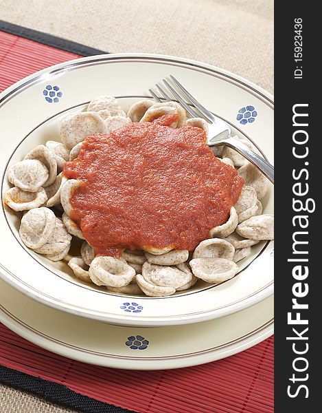 South italian traditional recipe orecchiette pasta with tomato sauce