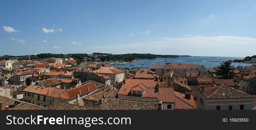 Panoramic landscape with the sky, the sea and rooftops, Porec, Croatia