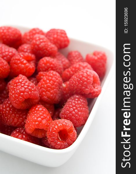 A full bowl of fresh raspberries. A full bowl of fresh raspberries