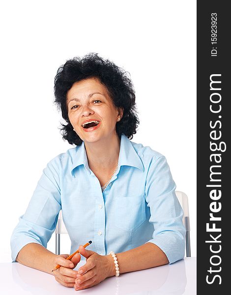 Elder woman smiling and sitting at the table. Elder woman smiling and sitting at the table.