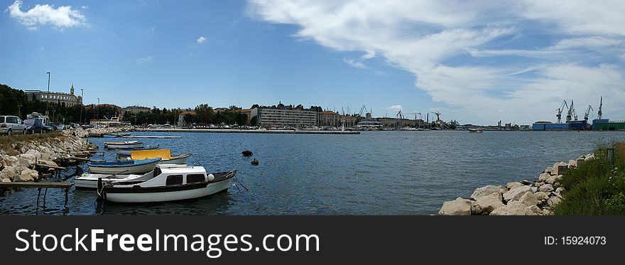 Panoramic landscape with the sky, the sea and the port city of Pula, Croatia
