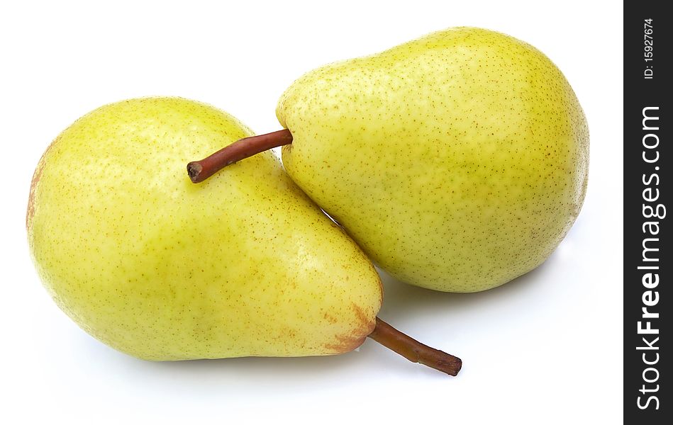 Two ripe, juicy pears on a white background clouse up. Two ripe, juicy pears on a white background clouse up