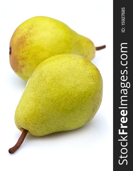 Two ripe, juicy pears on a white background. Two ripe, juicy pears on a white background