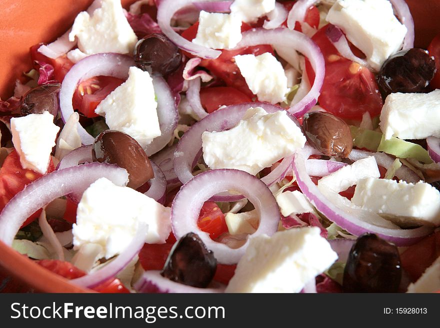 Close-up of greek salad in an earthenware bowl. Close-up of greek salad in an earthenware bowl