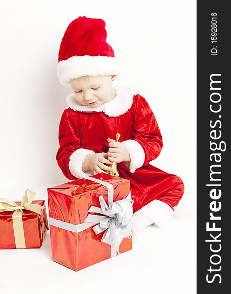 Little girl as Santa Claus with Christmas presents. Little girl as Santa Claus with Christmas presents