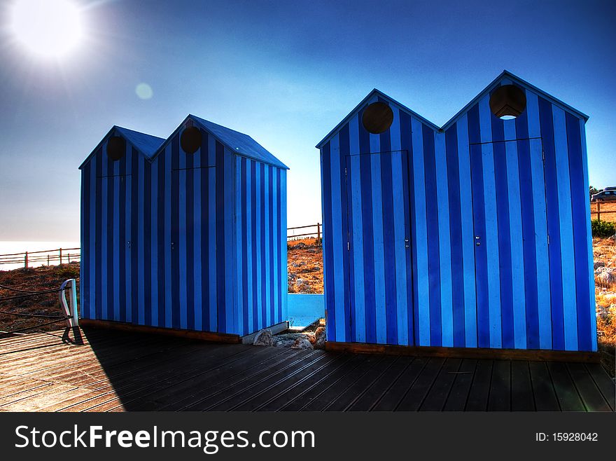 Two couples of Blue Old Style Beach Huts