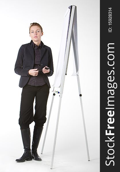 Young businesswoman standing at whiteboard. Young businesswoman standing at whiteboard