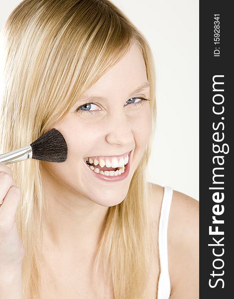 Portrait of smiling young woman with a brush. Portrait of smiling young woman with a brush