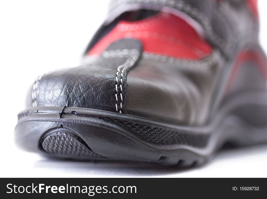 Macro view of sole of a child shoe isolated over white