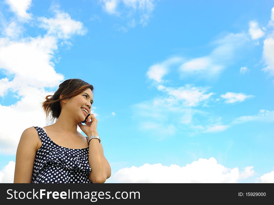 Asia Woman Is Talking A Telephone