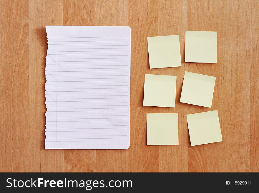 Blank stationery on wooden wall
