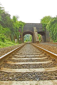 Rail Track Going Under Viaduct Stock Image