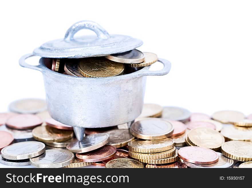 Heap of Euro coins in metal cauldron, isolated on white background. Heap of Euro coins in metal cauldron, isolated on white background