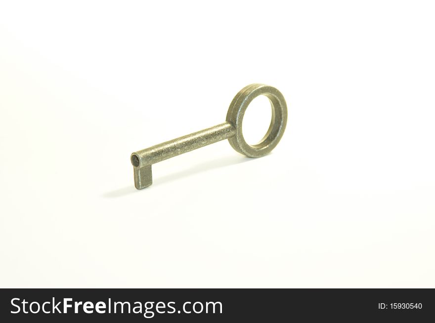 An image of an old style key against a white backdrop. An image of an old style key against a white backdrop.