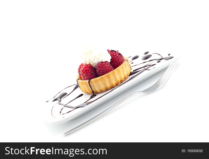 Cake with raspberry and cream on plate. Cake with raspberry and cream on plate