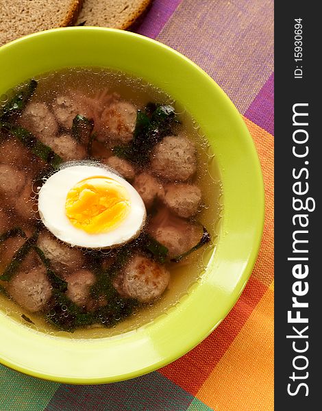Soup with meatballs and an egg