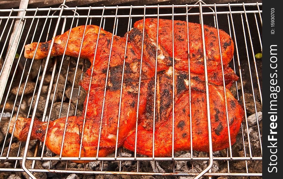 Indian style spicy chiken on grill. Indian style spicy chiken on grill