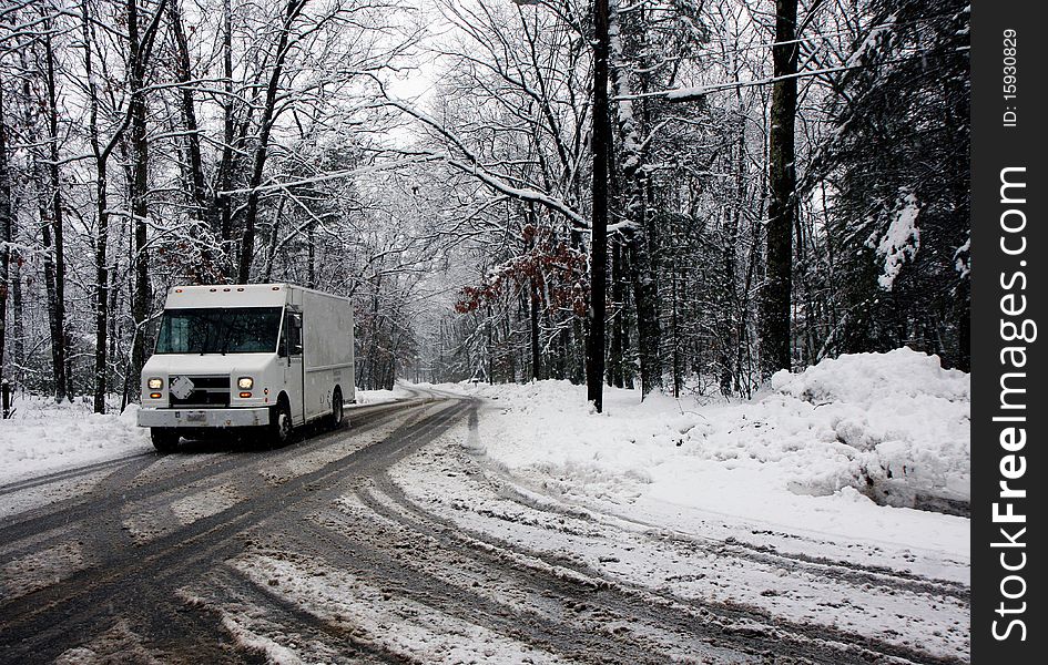 Truck On A Road In A Snowy Forest