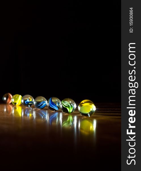 Row of Marbles in One-Point Lighting Background. Row of Marbles in One-Point Lighting Background