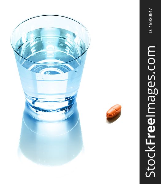 Pill and glass of pure water. Pill and glass of pure water