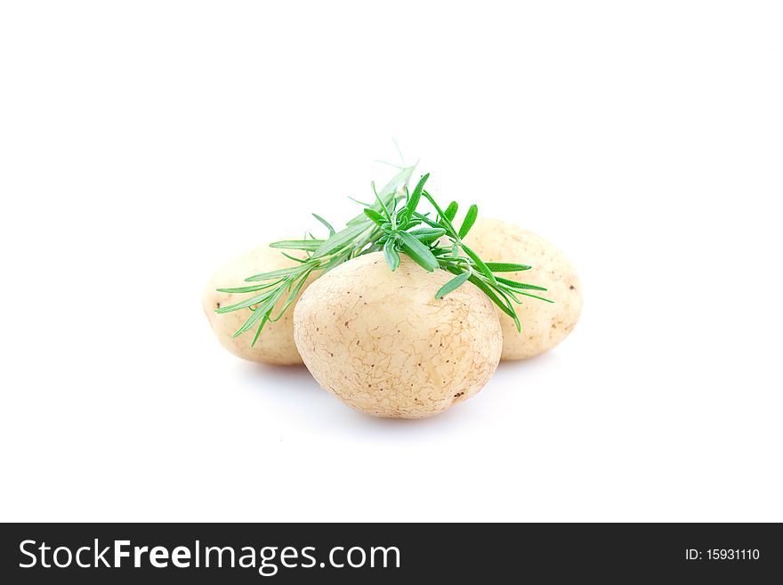 Potatoes and rosemary isolated on white