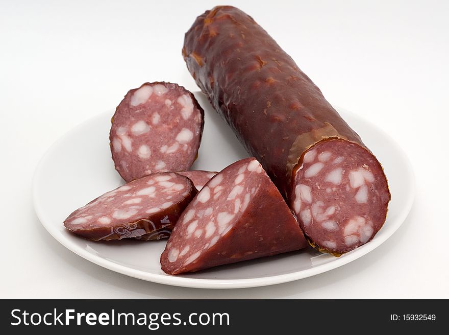 Sausage on a plate on a white background