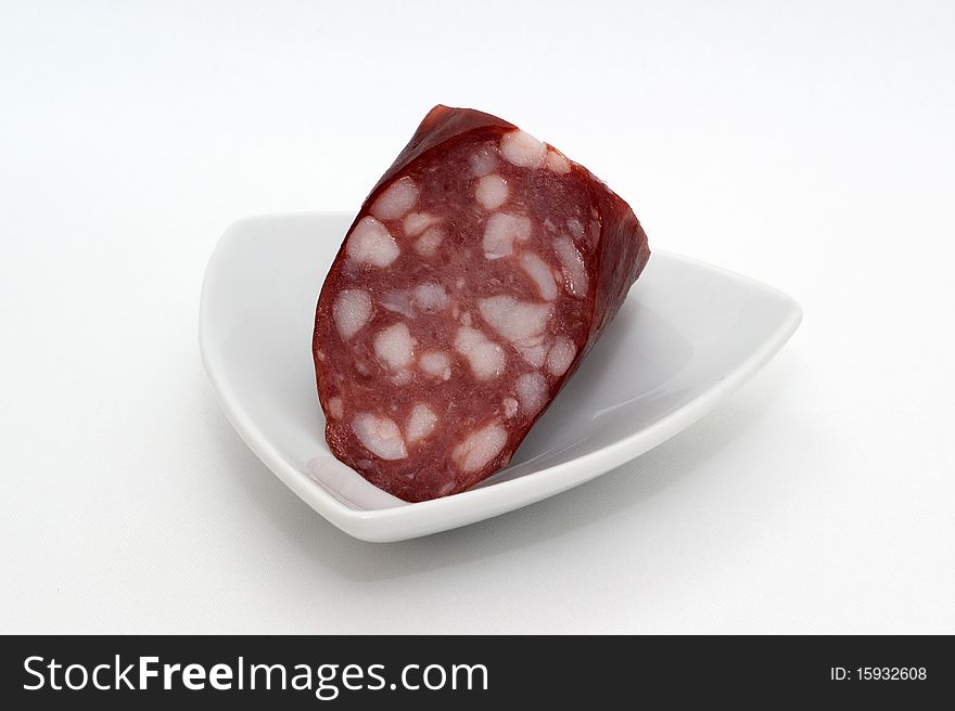 Sausage on a plate on a white background