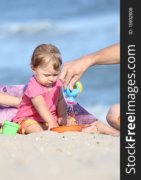 Child plays near the sea