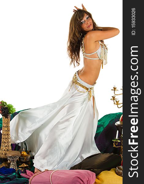 Woman in a white dress, dancing belly dance. Woman in a white dress, dancing belly dance
