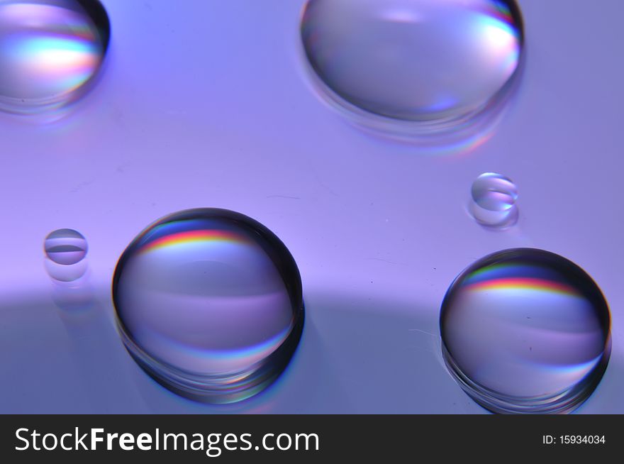 These are some water drops on a DVD. These are some water drops on a DVD