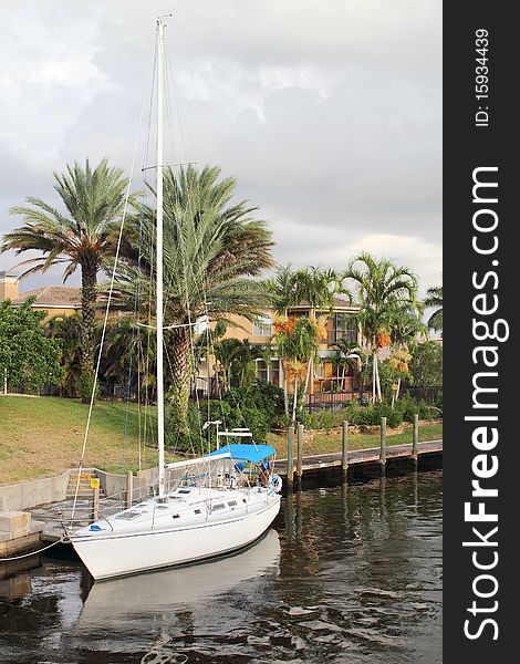 Beautiful evening in Florida. Sailboat Moored In Waterway