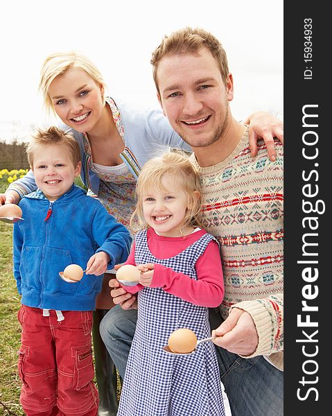 Family Having Egg And Spoon Race