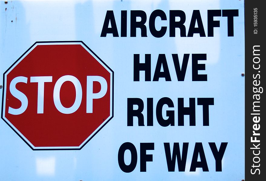 A sign stating that aircraft have the right of way. A sign stating that aircraft have the right of way